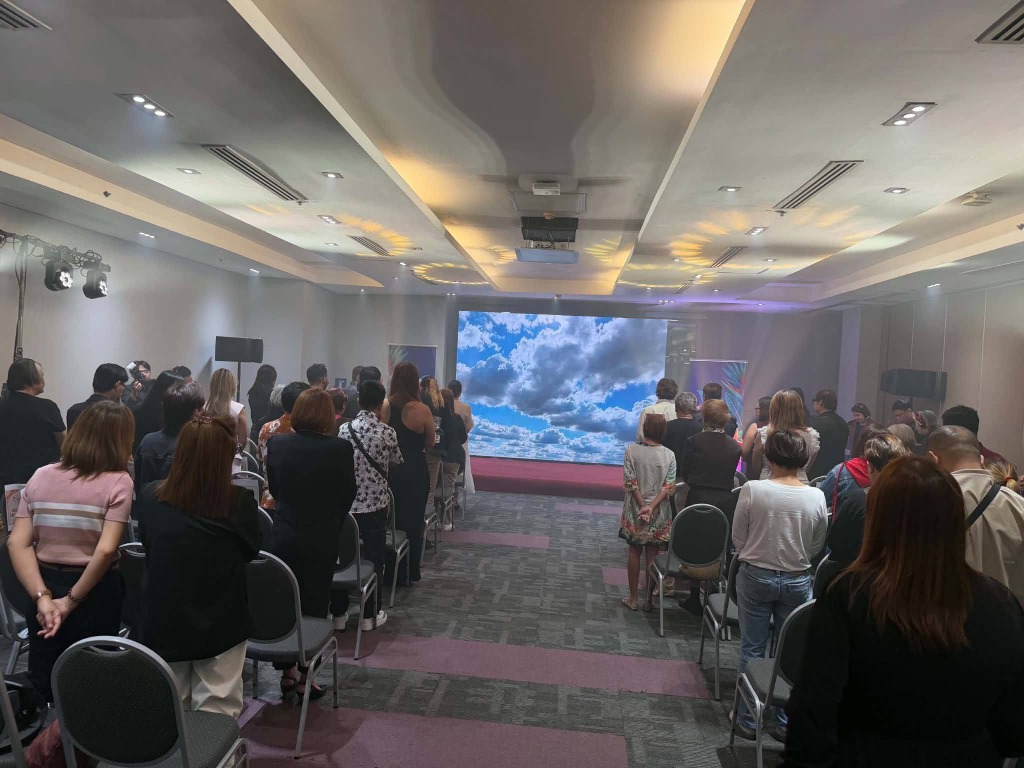 Audience standing for opening ceremony