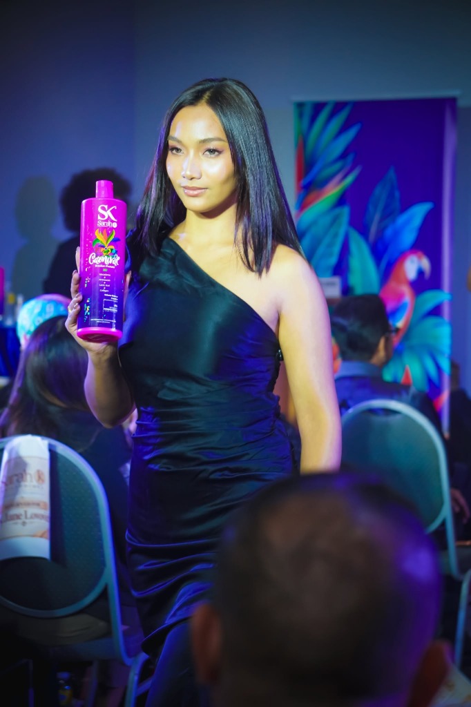 Model in evening gown with Carnival bottle